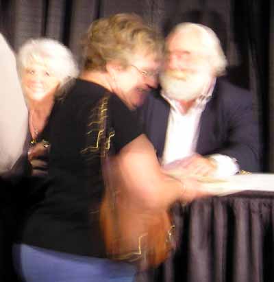 Paula Deen and husband Michael signing books
